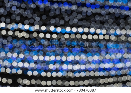  a blur picture of the white and blue bokeh light