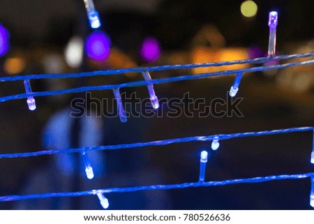 blue, purple led light cable and colorful bokeh background 