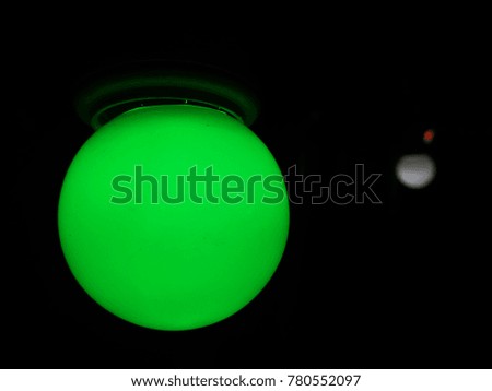 green light bulb at night.