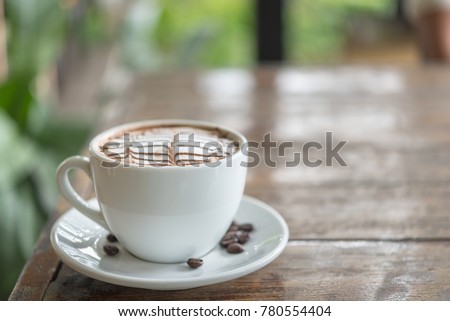 White coffee mug on patterned old wooden floor, coffee cup on the older wooden floor, black coffee, Americano, vertical picture.