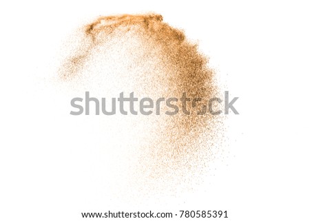 Gold sand explosion isolated on white background. Abstract sand cloud splash. Sandy fly wave in the air. Royalty-Free Stock Photo #780585391