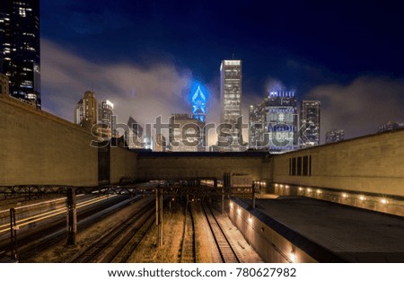 Chicago during blue hour from the train tracks beneath The Art Institute