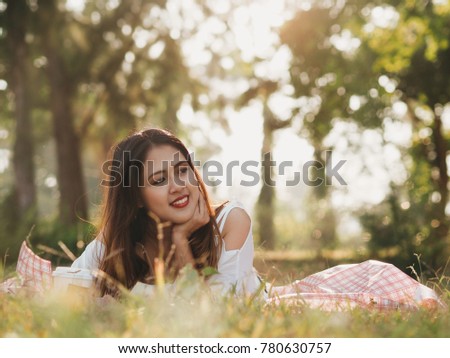 Happy Beautiful Asian woman in the field,travel concept.
