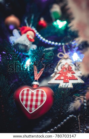 christmas toys hanging on tree 