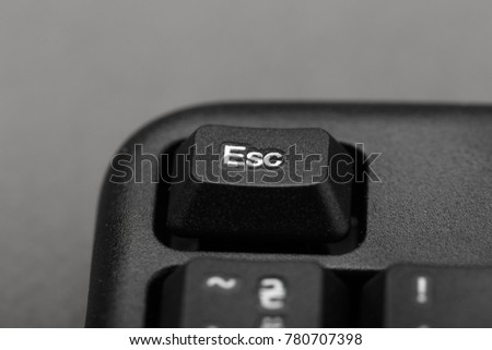 Escape button on the keyboard closeup, top view
