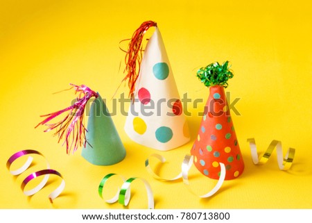 Caps for a party on a yellow background