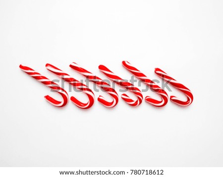 Christmas candy cane lollipop isolated on a white