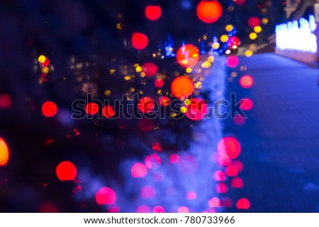 Festive red blurred decoration with blue light background