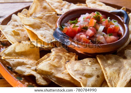 Traditional mexican salsa and nachos chips