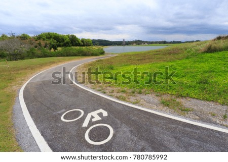 The Bicycle or Bike Sign on The Road with Nature Background. Copy Space for Text.