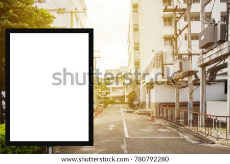 Blank advertising billboard or wide screen television with blurred shopping mall background, commercial and marketing concept, copy space for text or media content.