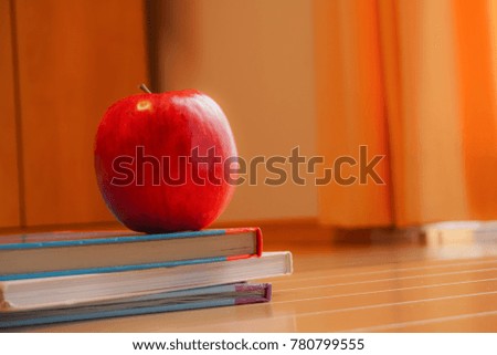   The red apple which was put in a room.                             