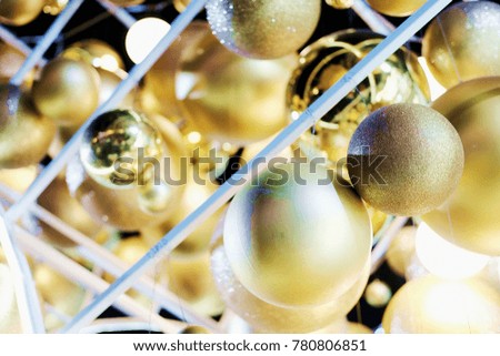 Beautiful lighting and Gold balls decorated hanging on White Christmas Trees Celebration with Bokeh blurred, fairy and sparkling background.Copy space