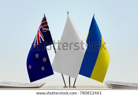 Flags of New Zealand and Ukraine with a white flag in the middle