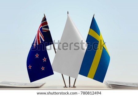 Flags of New Zealand and Sweden with a white flag in the middle