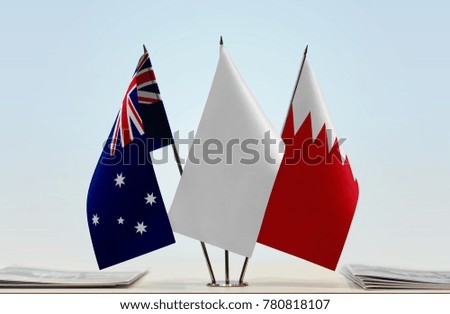 Flags of Australia and Bahrain with a white flag in the middle