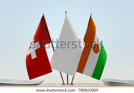 Flags of Switzerland and Niger with a white flag in the middle