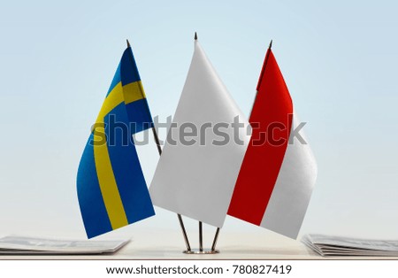 Flags of Sweden and Indonesia with a white flag in the middle