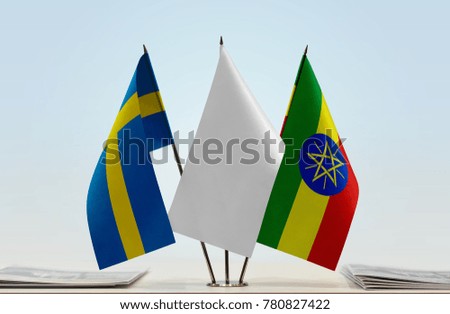 Flags of Sweden and Ethiopia with a white flag in the middle