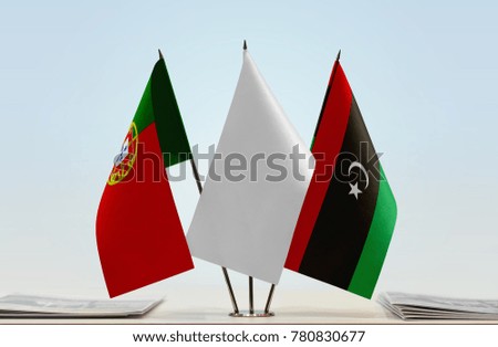 Flags of Portugal and Libya with a white flag in the middle