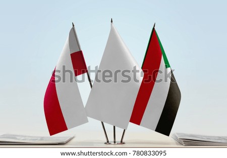 Flags of Poland and Sudan with a white flag in the middle