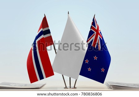 Flags of Norway and New Zealand with a white flag in the middle