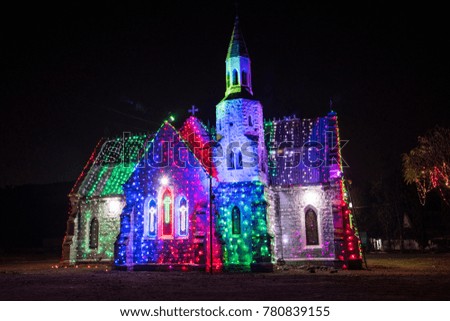 Church in city decorated and illuminated during the Christmas and New Year season