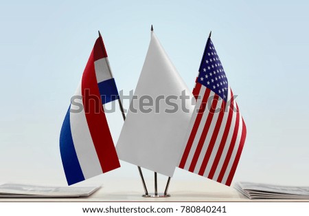 Flags of Netherlands and USA with a white flag in the middle