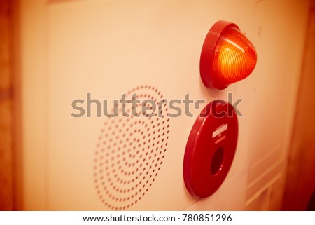 Emergency light wall panel and alarm speaker sound in the office building.