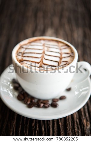 White coffee mug on patterned old wooden floor, coffee cup on the older wooden floor, black coffee, Americano, vertical picture.