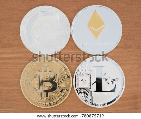 Real coins of different cryptocurrency Bitcoin Ethereum Dogecoin and Litecoin