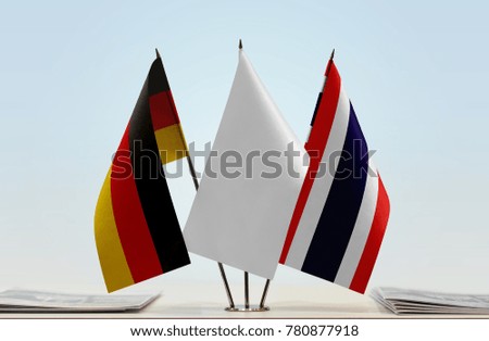 Flags of Germany and Thailand with a white flag in the middle
