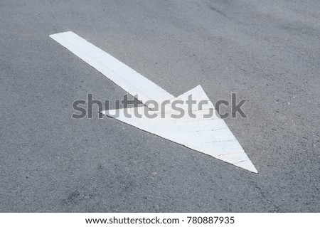 Arrow road marking made from thermoplastic. Signage show direction for the road users. 