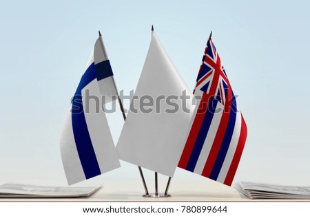 Flags of Finland and Hawaii with a white flag in the middle