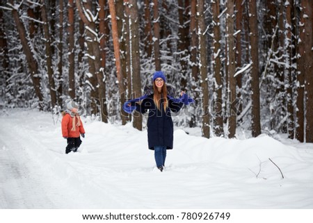 winter fun. boy with a girl walking on a winter road