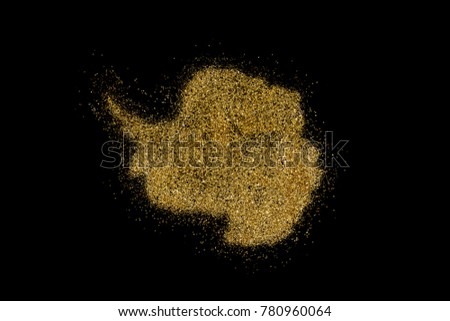 Antarctica shaped from golden glitter on a black background (series)