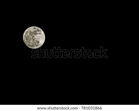 Full moon on dark night sky background 