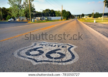 U.S. Route 66 highway, with sign on asphalt on Missouri.  Royalty-Free Stock Photo #781050727