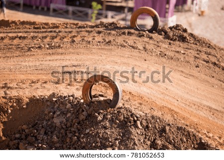 Tires on a red clay track for motorcycles