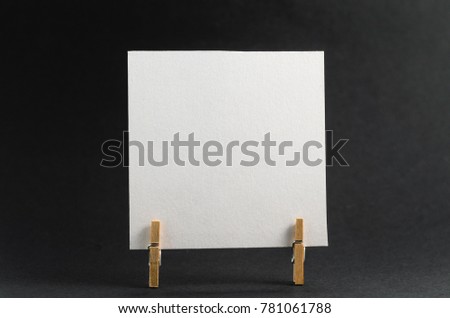 The sticker with the greeting happy Valentines day on the clothespin on a dark background
