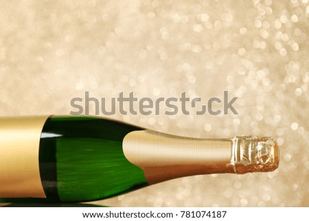 Champagne bottle on lights background