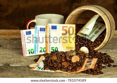 Roasted coffee beans and valid euro banknotes. Coffee trading. Sale of commodities