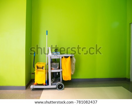 Cleaning tools cart wait for cleaning.Bucket and set of cleaning equipment in the office. cleaning services concept