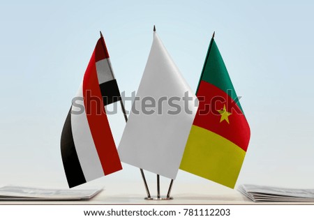 Flags of Yemen and Cameroon with a white flag in the middle