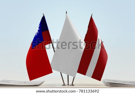 Flags of Taiwan and Latvia with a white flag in the middle