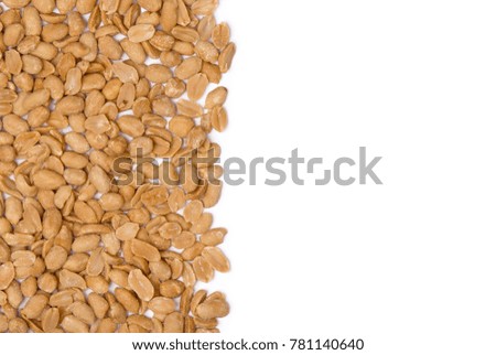 Peanuts. Peanuts on a blank (white) background, arranged on left side, with copy space. Top view.