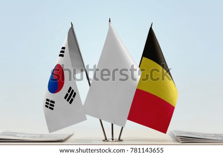 Flags of South Korea and Belgium with a white flag in the middle