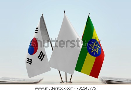 Flags of South Korea and Ethiopia with a white flag in the middle