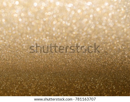 Gold bokeh background with luxury glitter golden bokeh light for background, wallpaper and web template design, blurred Christmas celebration light 