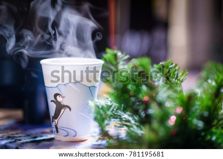 Hot tea cup in the winter on Christmas market